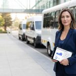 Corporate woman boarding a shuttle transport