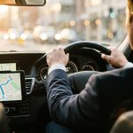 driver driving a car with a screen