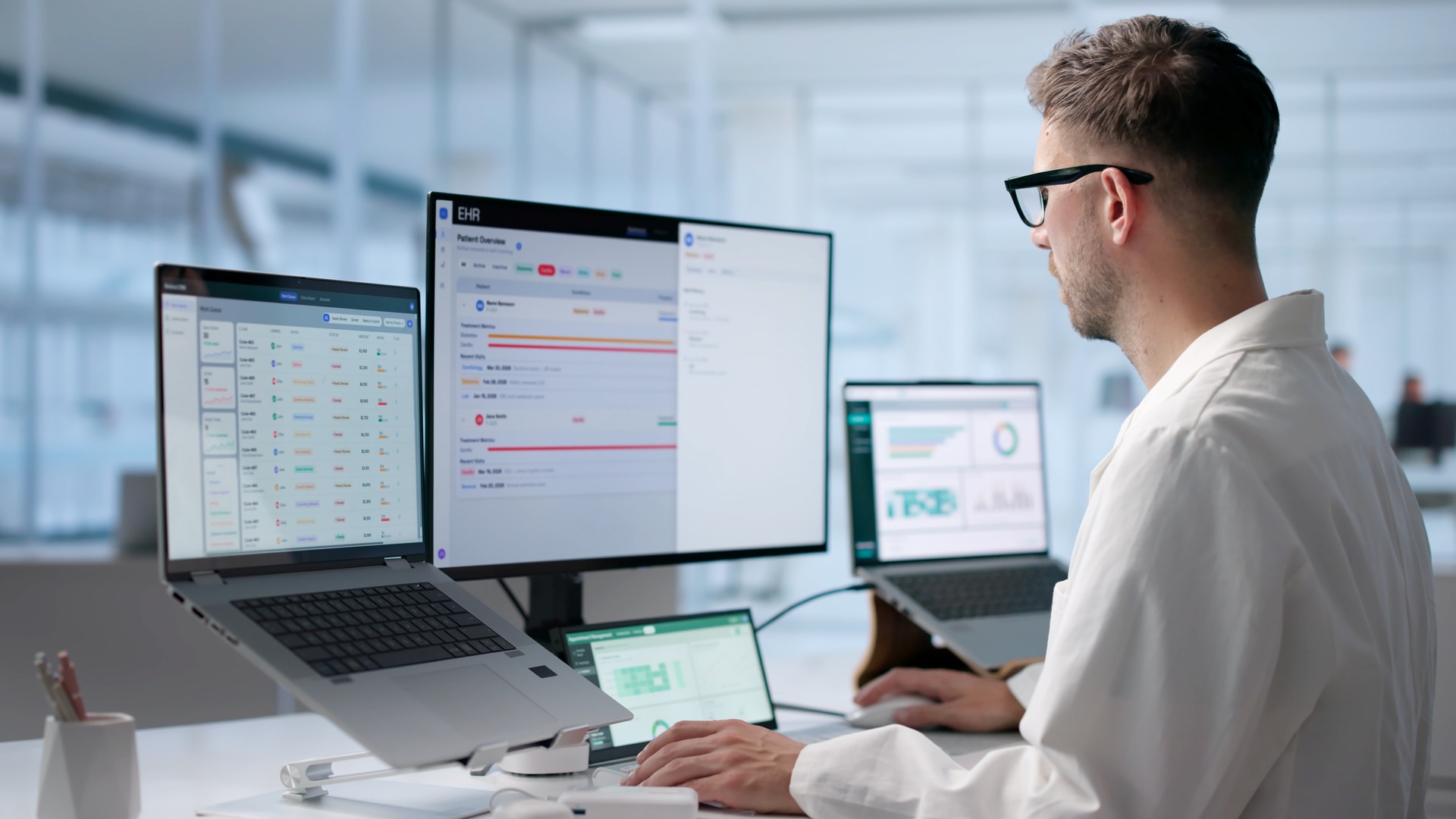 Man sitting infront of screens